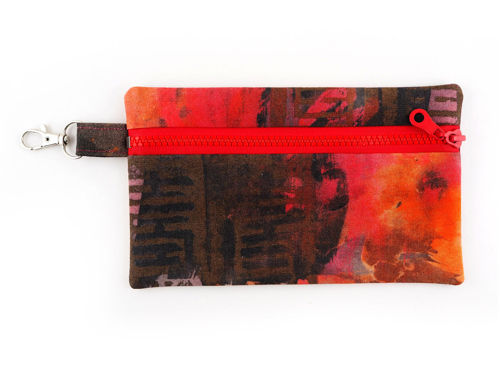 Handmade travel pouch in red painterly fabric