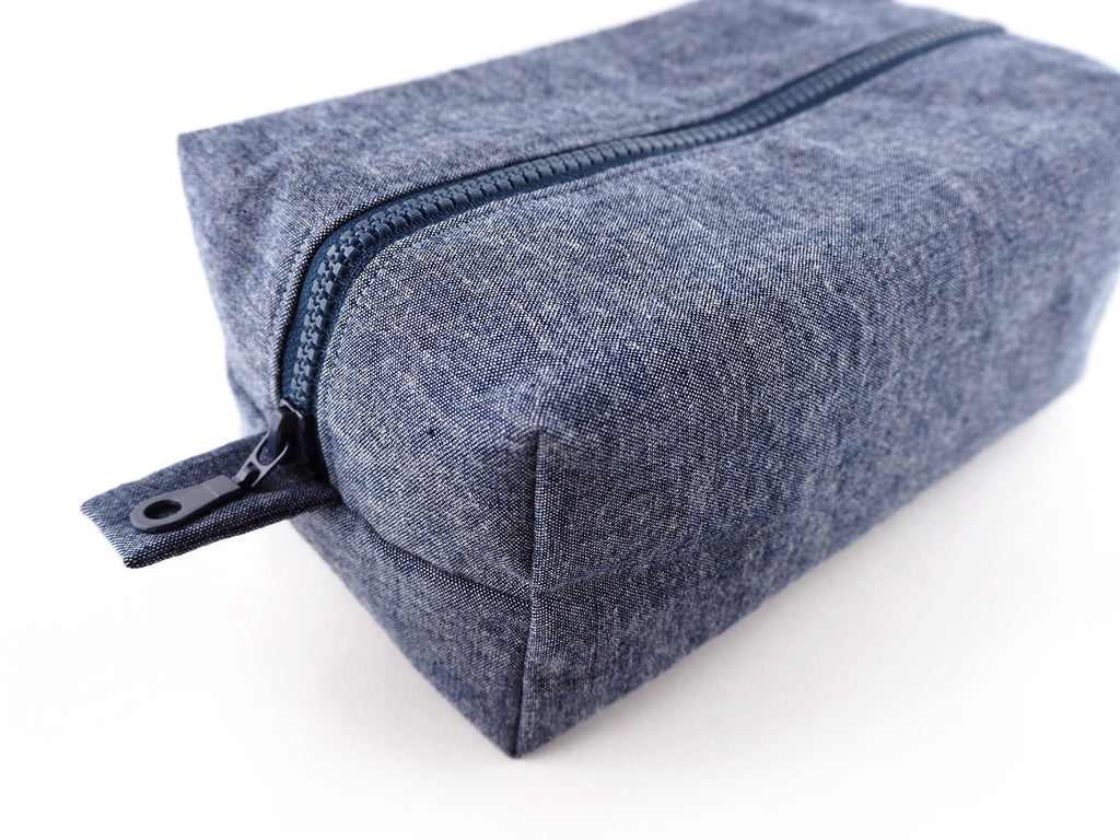 Handmade denim travel bag with chunky zip