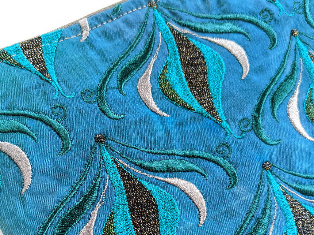 Embroidered turquoise purse