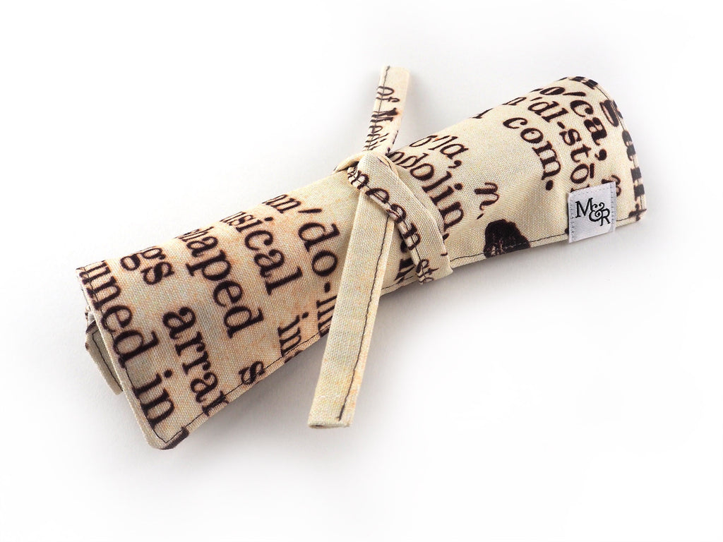 Handmade antique text print pencil roll