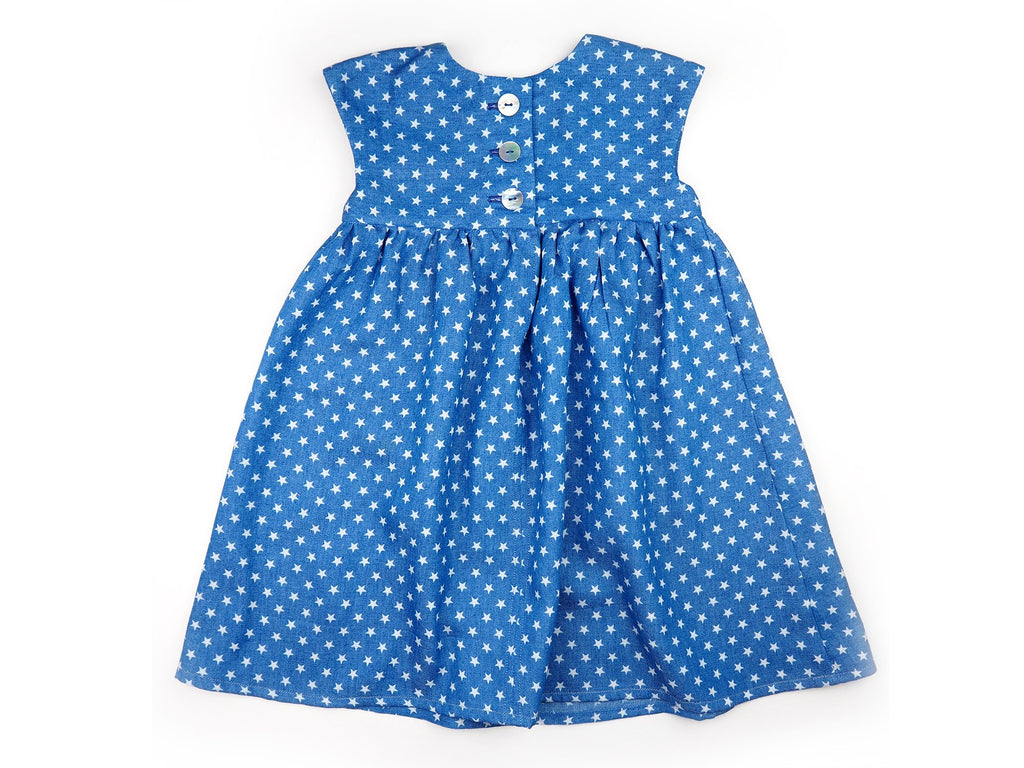 Back view of handmade girl's dress in blue fabric with star print