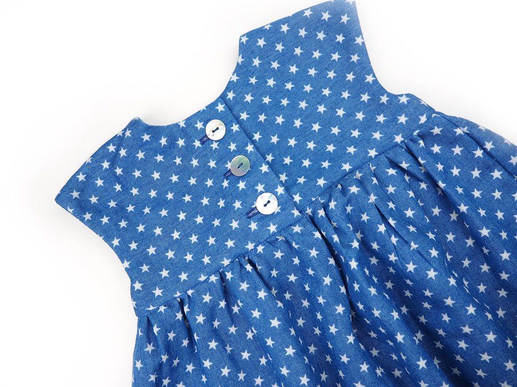 Shell buttons on a handmade star print girl's dress